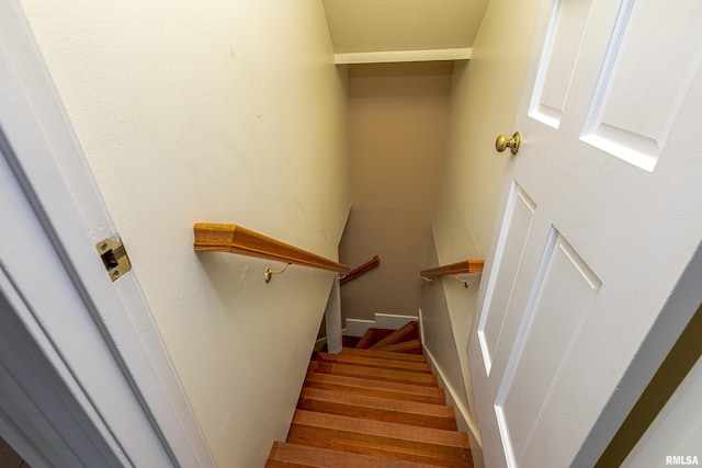 stairs with wood-type flooring