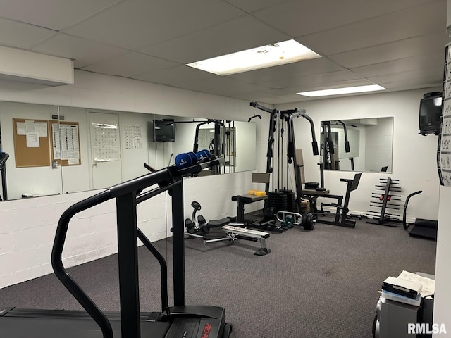 exercise room with a drop ceiling