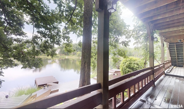 wooden deck with a water view