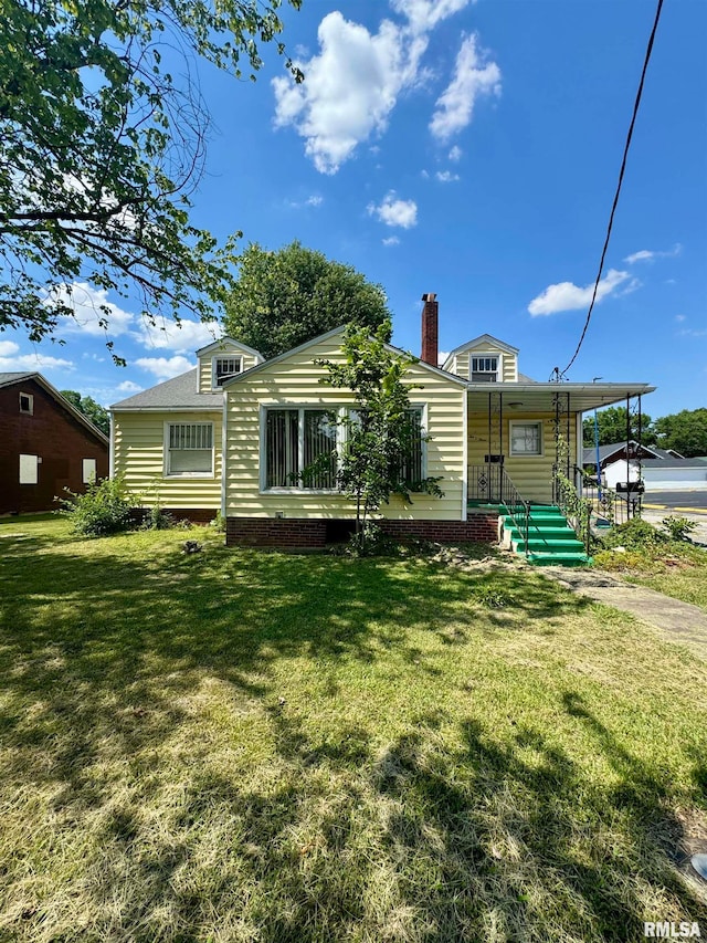 view of front of home with a front lawn