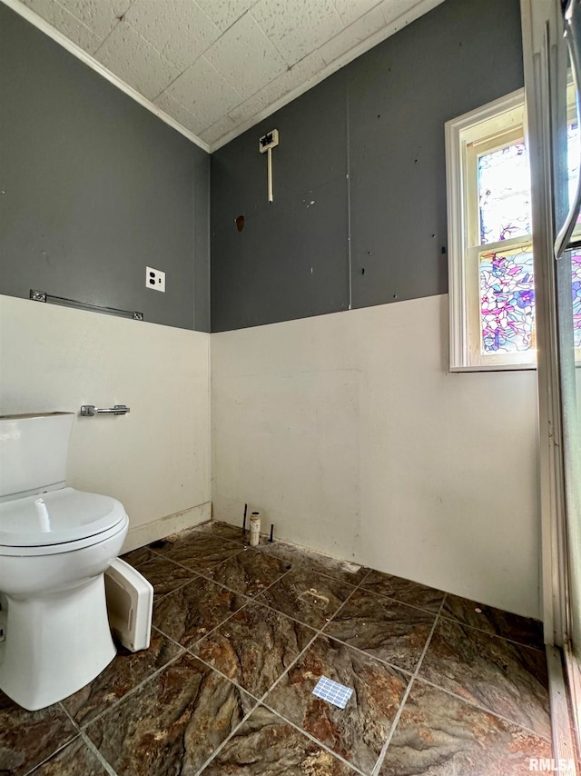 bathroom with tile flooring and toilet