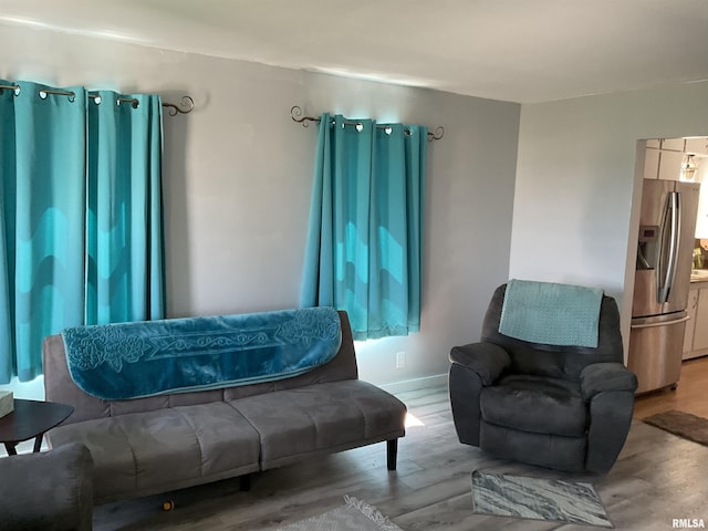 living area with light hardwood / wood-style flooring