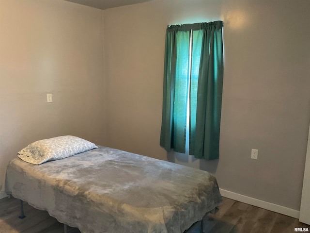 bedroom featuring hardwood / wood-style flooring