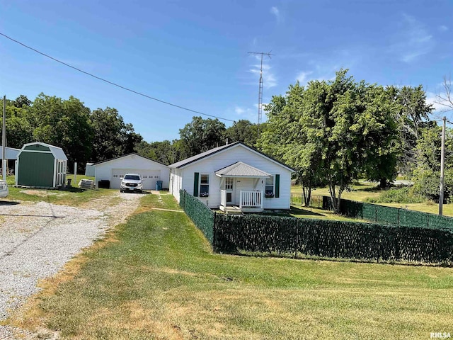 view of yard with a shed and a garage