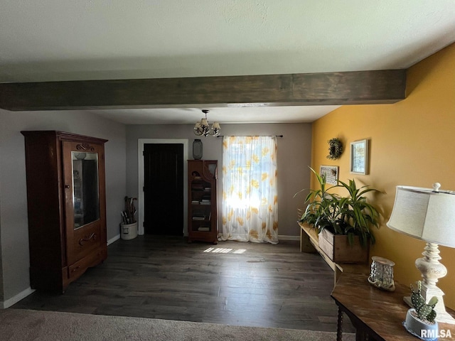 interior space featuring an inviting chandelier, beam ceiling, and dark hardwood / wood-style flooring