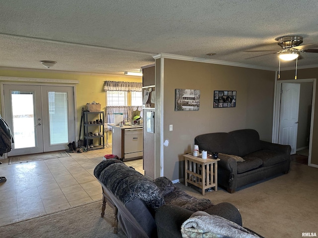 living area with a textured ceiling, light colored carpet, crown molding, and french doors