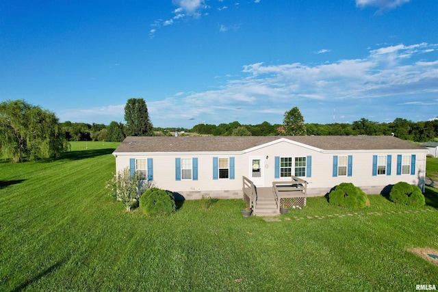 view of front of property featuring a front yard and a wooden deck