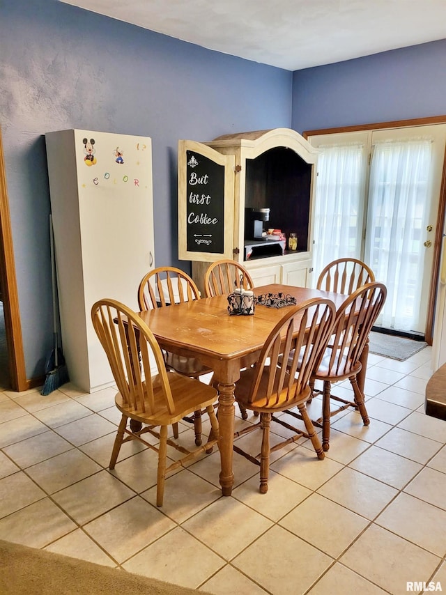 dining room featuring light tile patterned floors