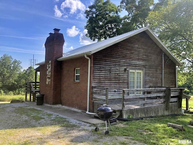 view of side of home featuring a deck