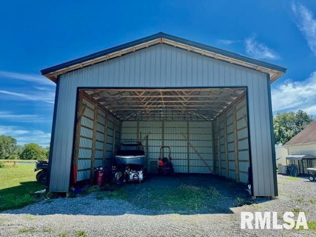 garage featuring a carport