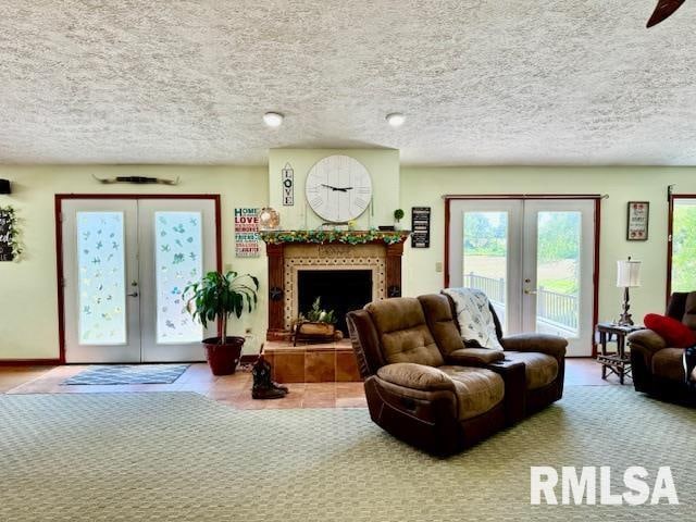 living room with french doors and a textured ceiling