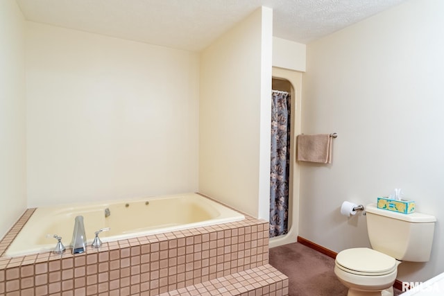 bathroom featuring a textured ceiling and toilet