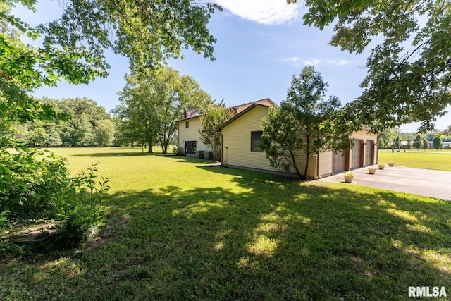 view of yard featuring a garage