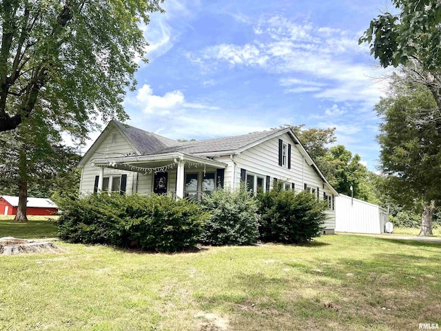 view of side of home featuring a yard