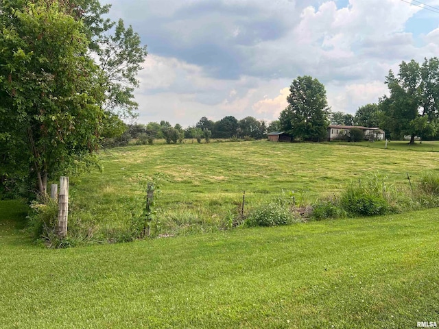 view of yard with a rural view