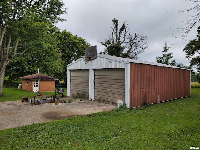 garage featuring a yard