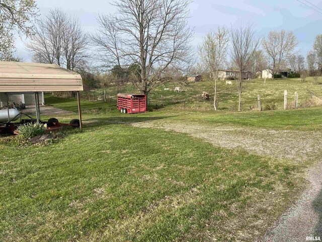 view of yard with a carport