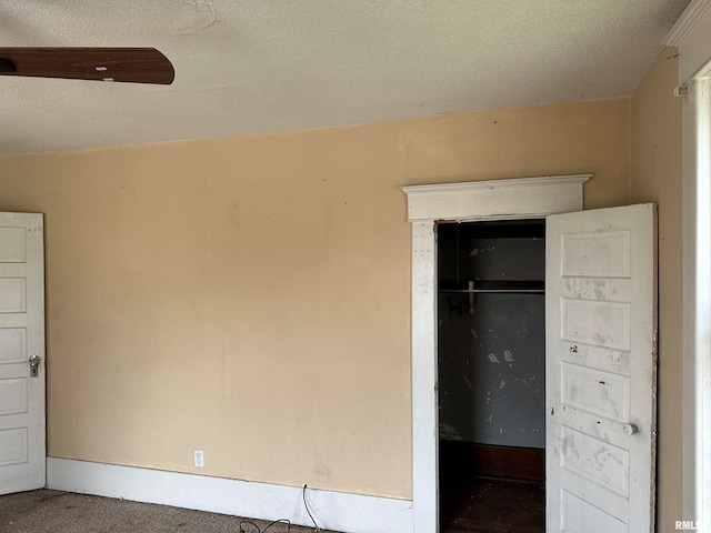 unfurnished bedroom with a closet and a textured ceiling