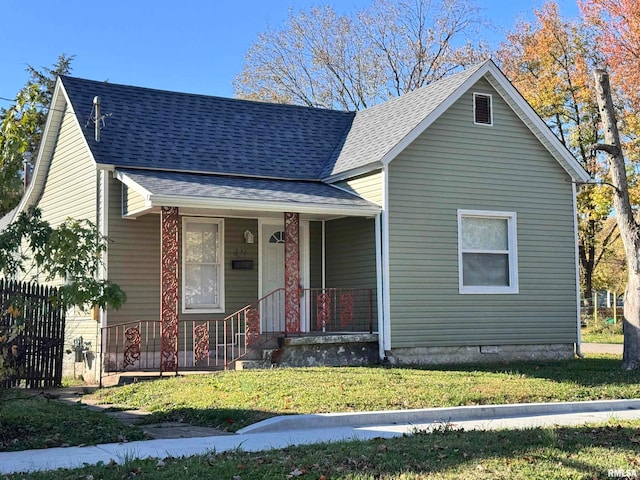 bungalow-style home featuring a porch and a front lawn