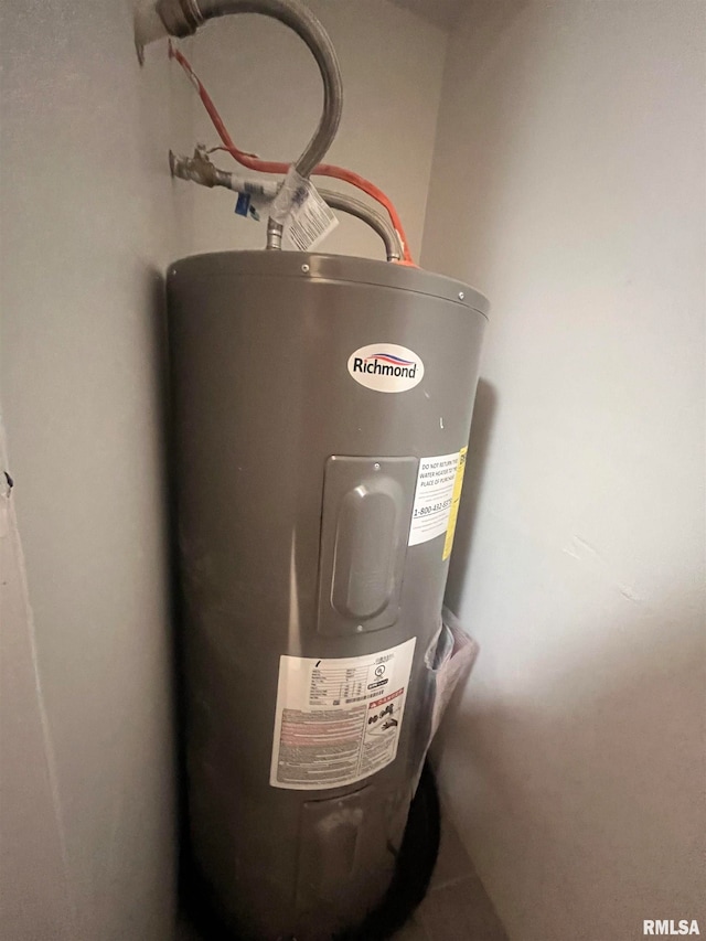 utility room featuring water heater