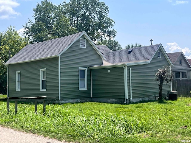 rear view of house with a lawn