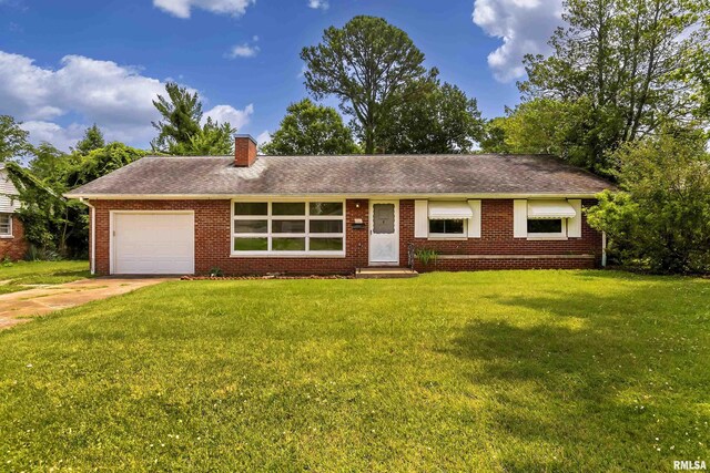 ranch-style home with a garage and a front yard