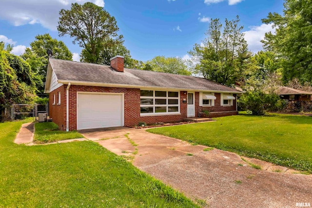 ranch-style home featuring a garage and a front lawn