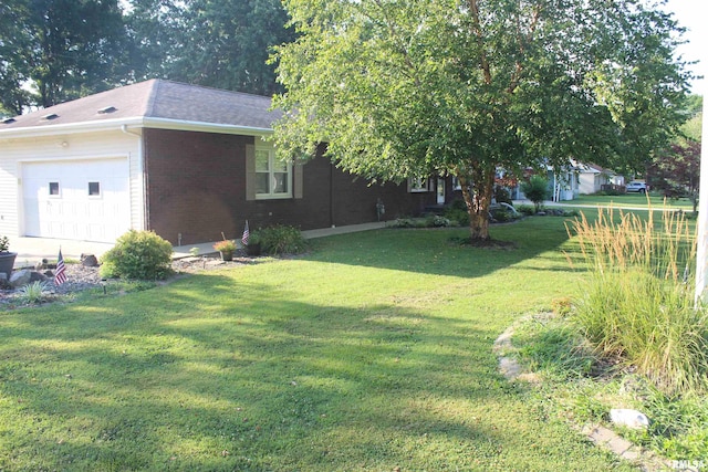 view of yard with a garage