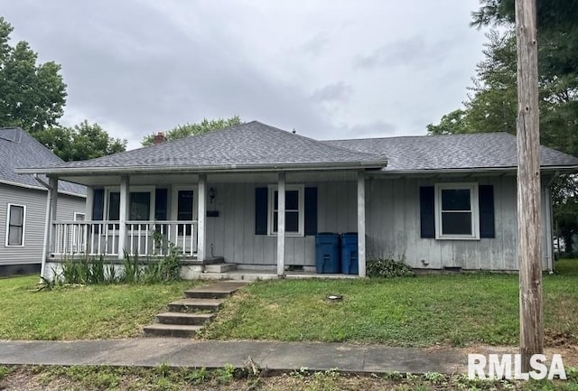 view of front of home with a front lawn and covered porch