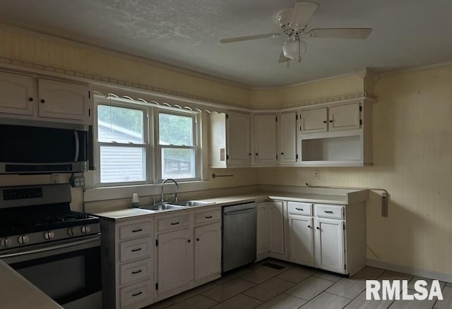 kitchen featuring white cabinetry, sink, and stainless steel appliances