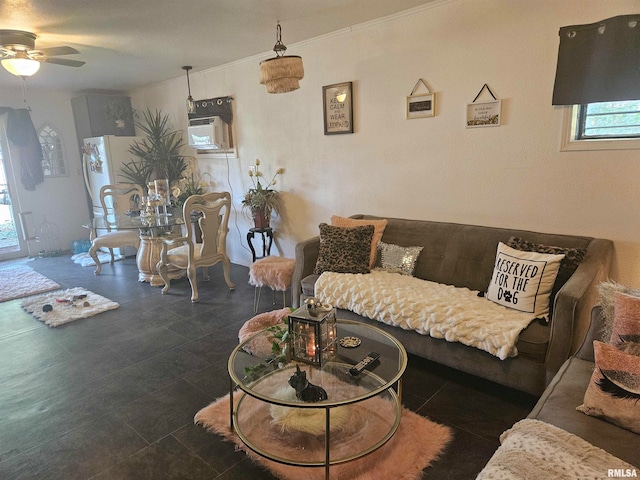 living room with an AC wall unit and ceiling fan