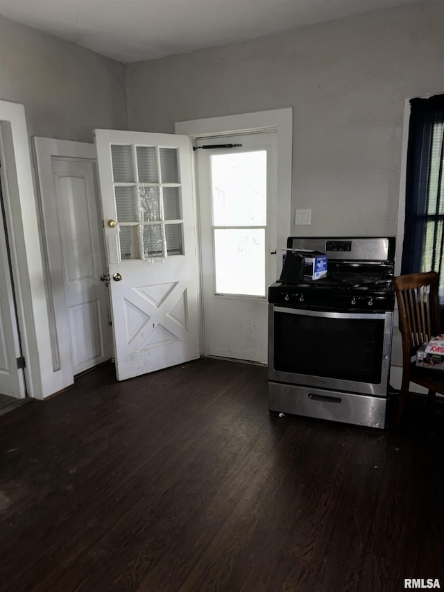 kitchen featuring dark wood-type flooring and gas stove