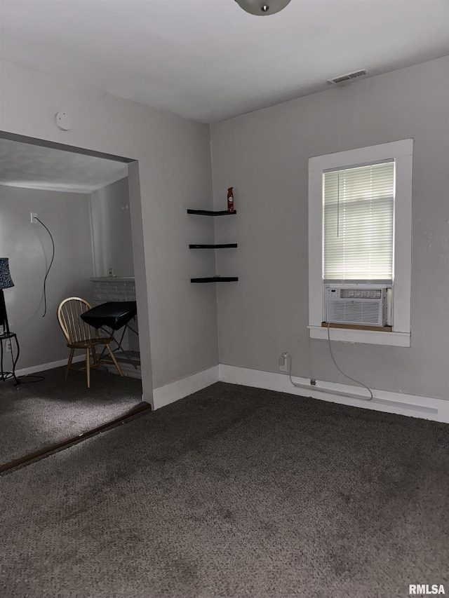 carpeted spare room with cooling unit