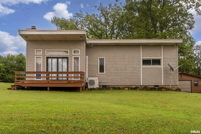 back of house with a yard and a deck