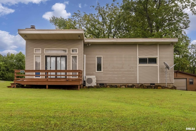 back of house with a wooden deck, ac unit, and a lawn