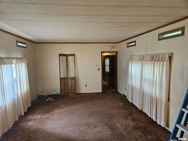 carpeted empty room with crown molding