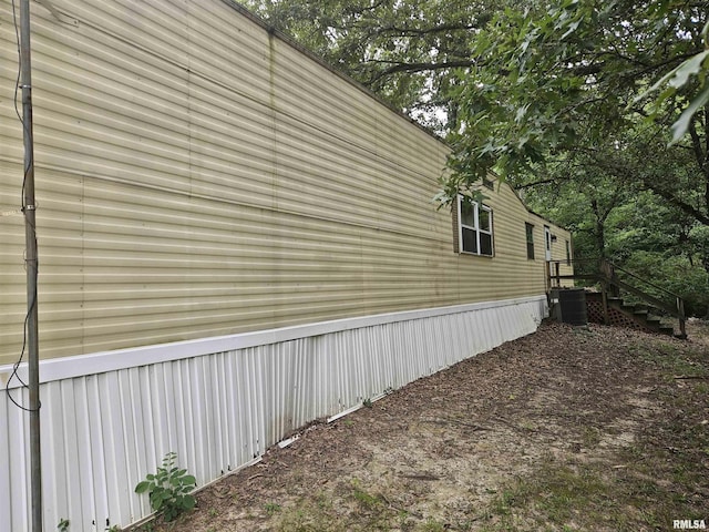 view of property exterior featuring central AC