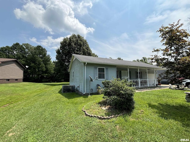 view of front of home with covered porch and a front yard