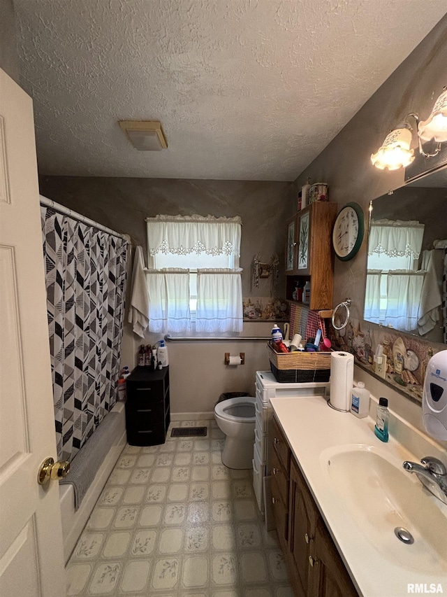 full bathroom with a textured ceiling, toilet, shower / bathtub combination with curtain, and vanity