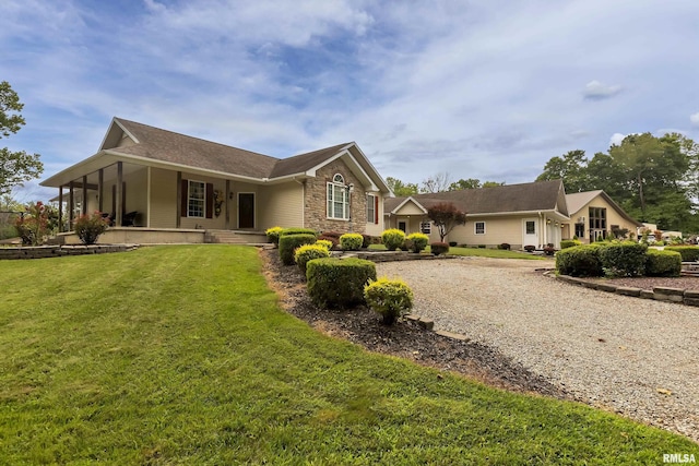 exterior space with a porch and a front yard