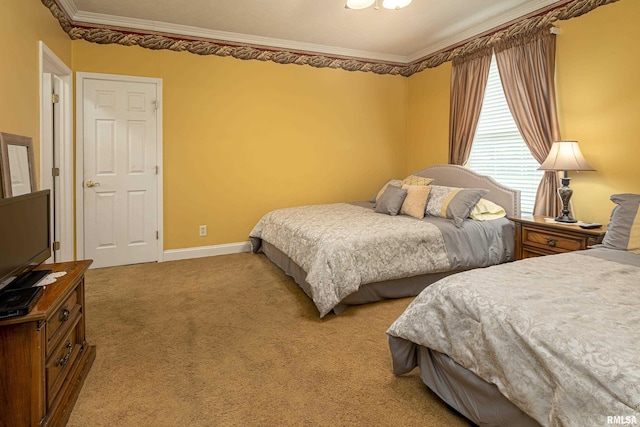 bedroom featuring crown molding and carpet floors