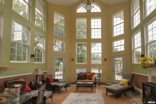 sunroom featuring a wood stove