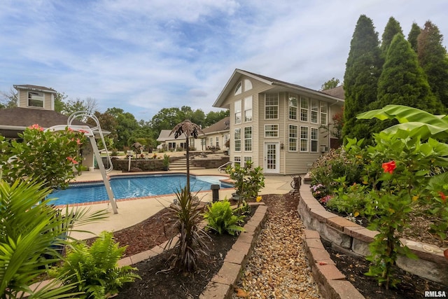 view of swimming pool with a patio area