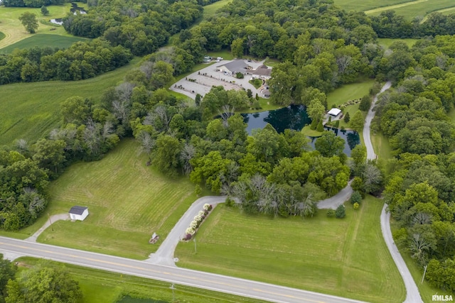 birds eye view of property with a water view and a rural view