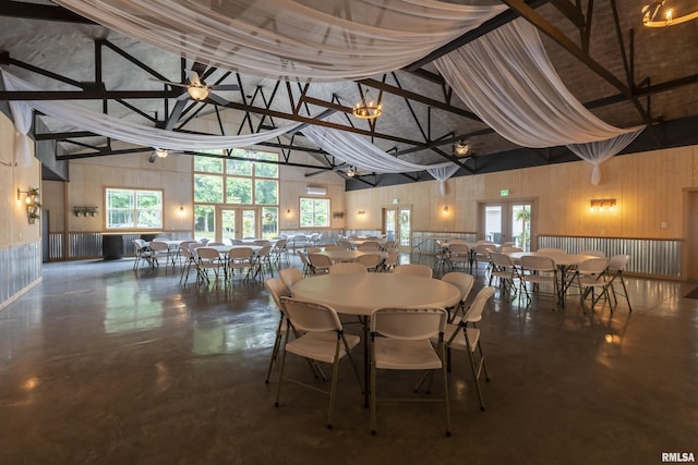 dining area featuring plenty of natural light, high vaulted ceiling, beamed ceiling, and ceiling fan