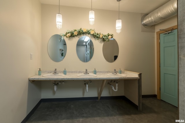 bathroom featuring vanity and concrete flooring