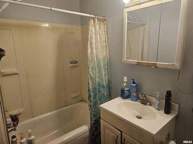 bathroom with vanity and shower / tub combo