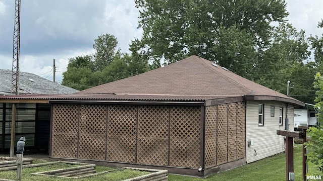 view of property exterior with a lawn