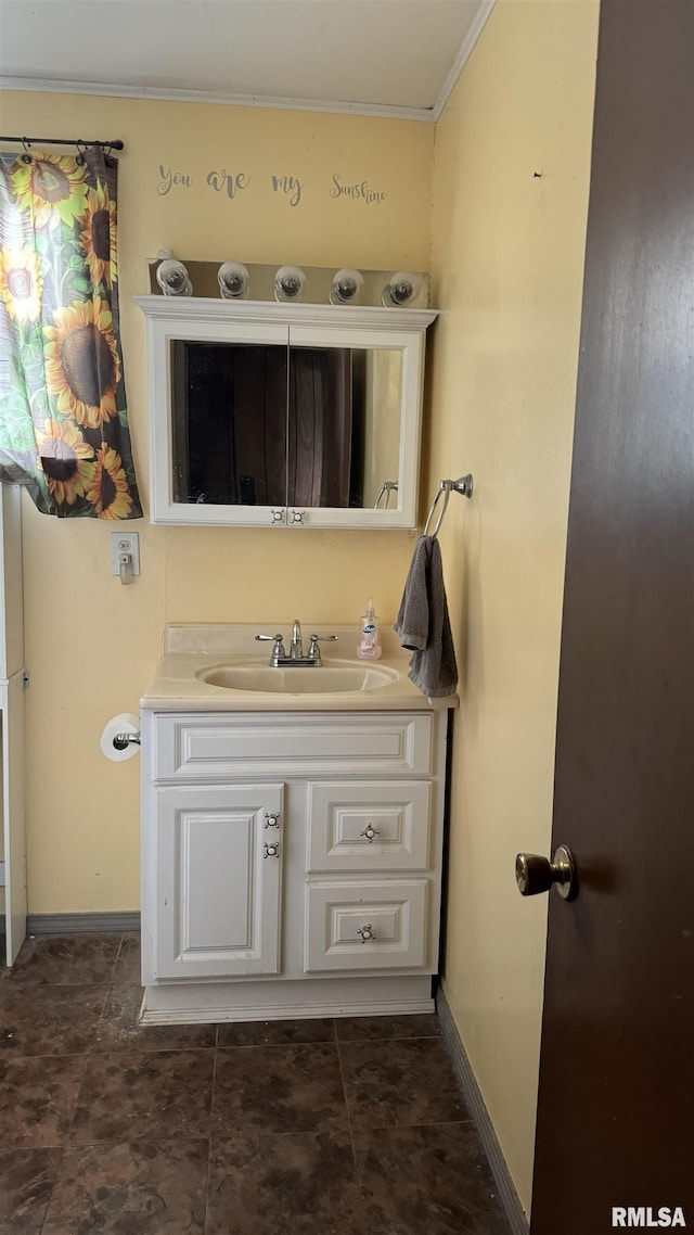 bathroom with vanity and ornamental molding