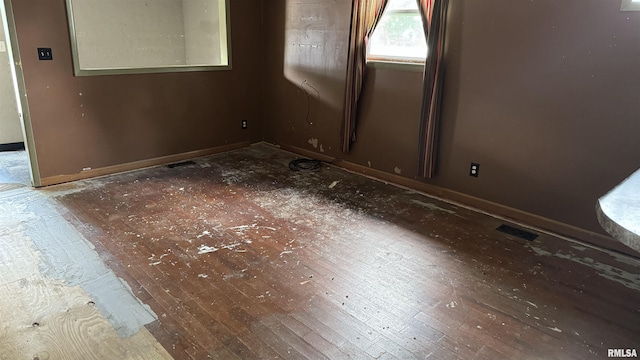 spare room featuring hardwood / wood-style floors